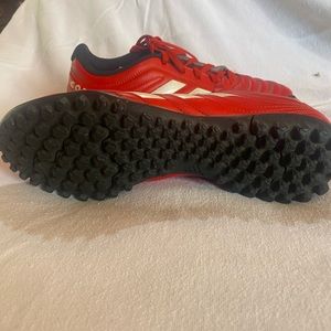 Adidas indoor soccer shoe.